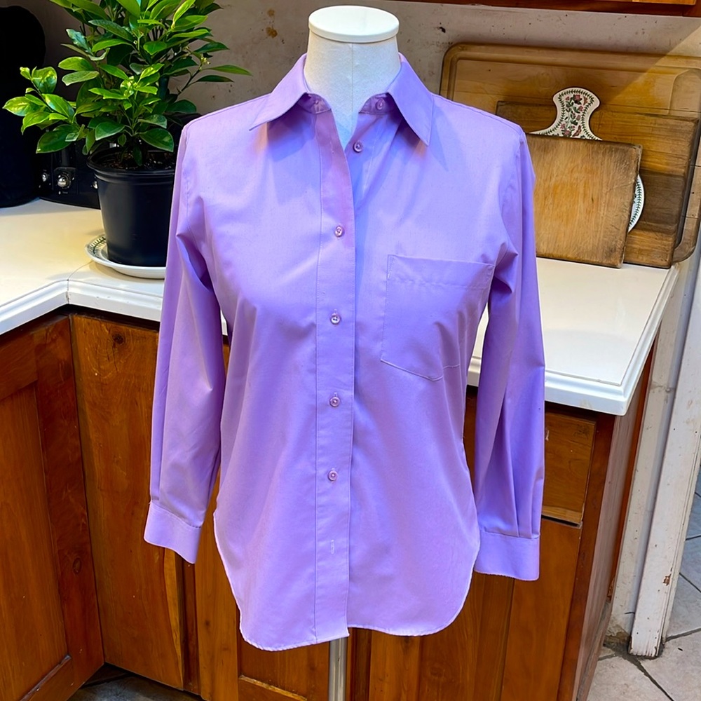 This is a lavender women’s shirt by Foxcroft. It is a size 4. It is NWOT’s